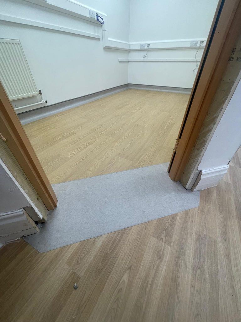 324421406_738981097441207_4461476202011292233_n office laminate flooring
